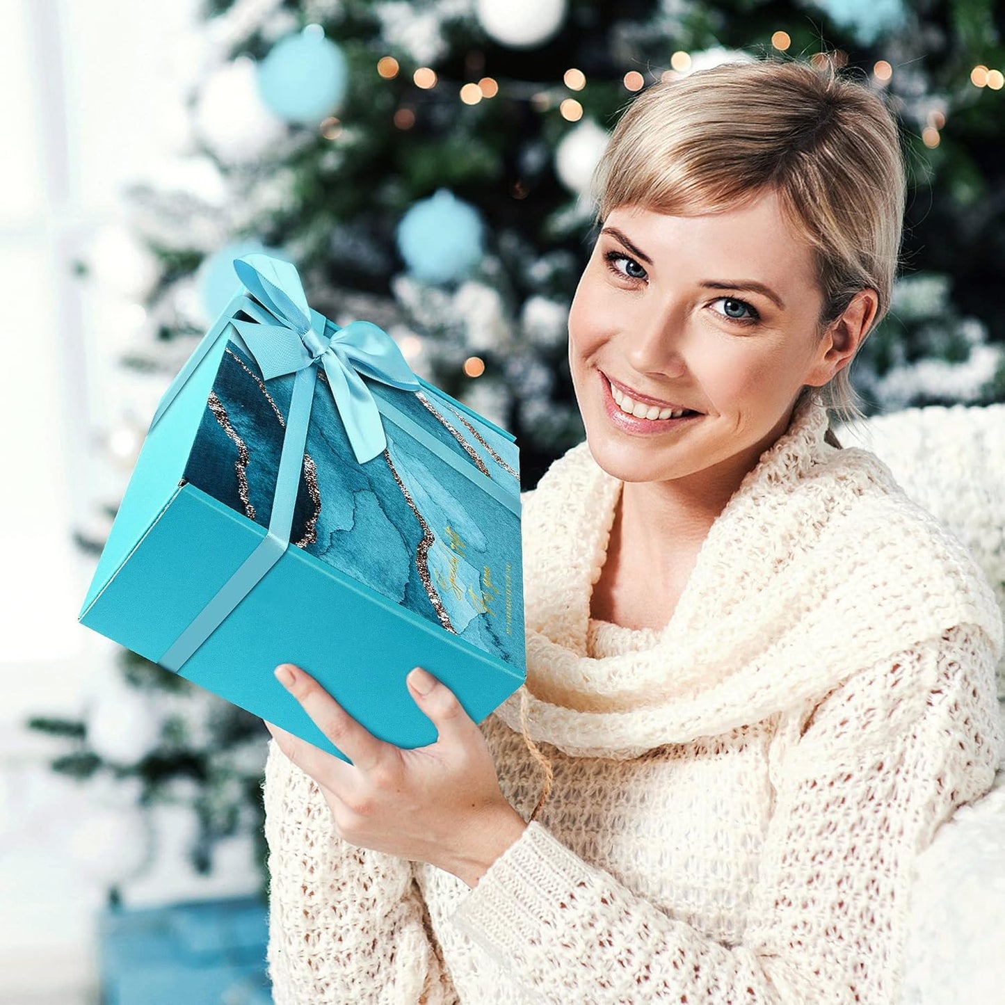 Teal ribboned spa gift basket held by a woman, 6-piece gift set