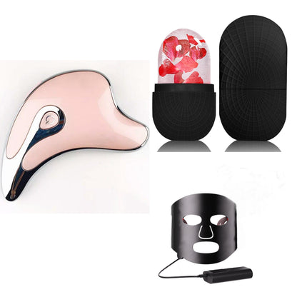 Electric facial massager set with pink gua sha head and black storage caps