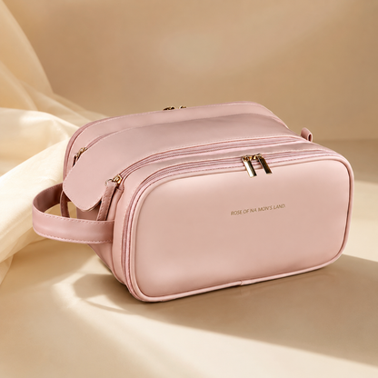 Pink travel makeup organizer bag with top flap and gold-tone double zippers