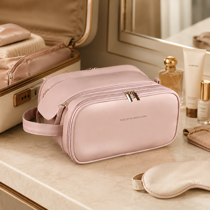 Pink travel makeup organizer bag with shoulder strap and gold-tone double zipper