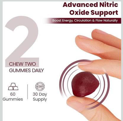 Pomegranate-flavored beet root gummy held between fingers
