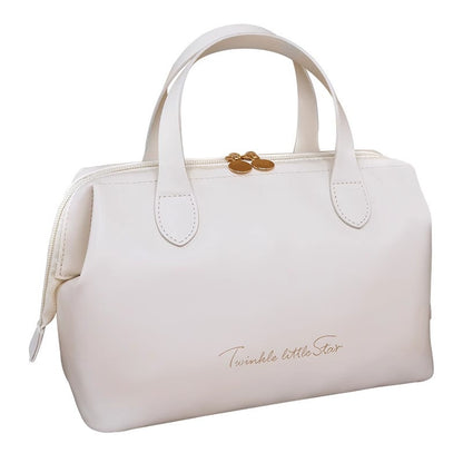 Cream beauty organizer bag with double handles and gold-tone clasp on top
