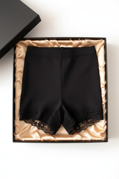 Black butt-lifting underwear shorts with lace trim, folded in gift box