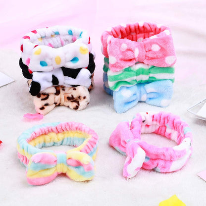 Assorted plush bow headbands: pink stripes, leopard print, confetti dots, tie-knot