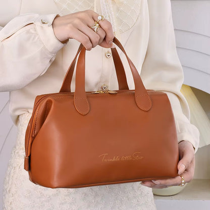 Brown beauty organizer bag with double top handles and front zipper pocket