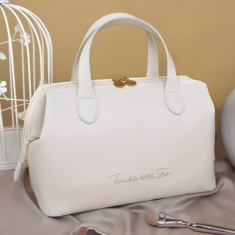 Cream beauty organizer bag with double handles and gold-tone top clasp