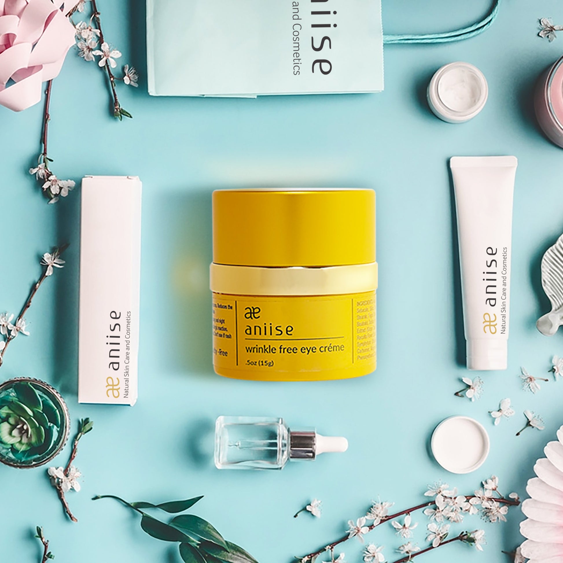 Wrinkle free eye crème jar set: yellow jar with gold lid and matching tube, aniiise