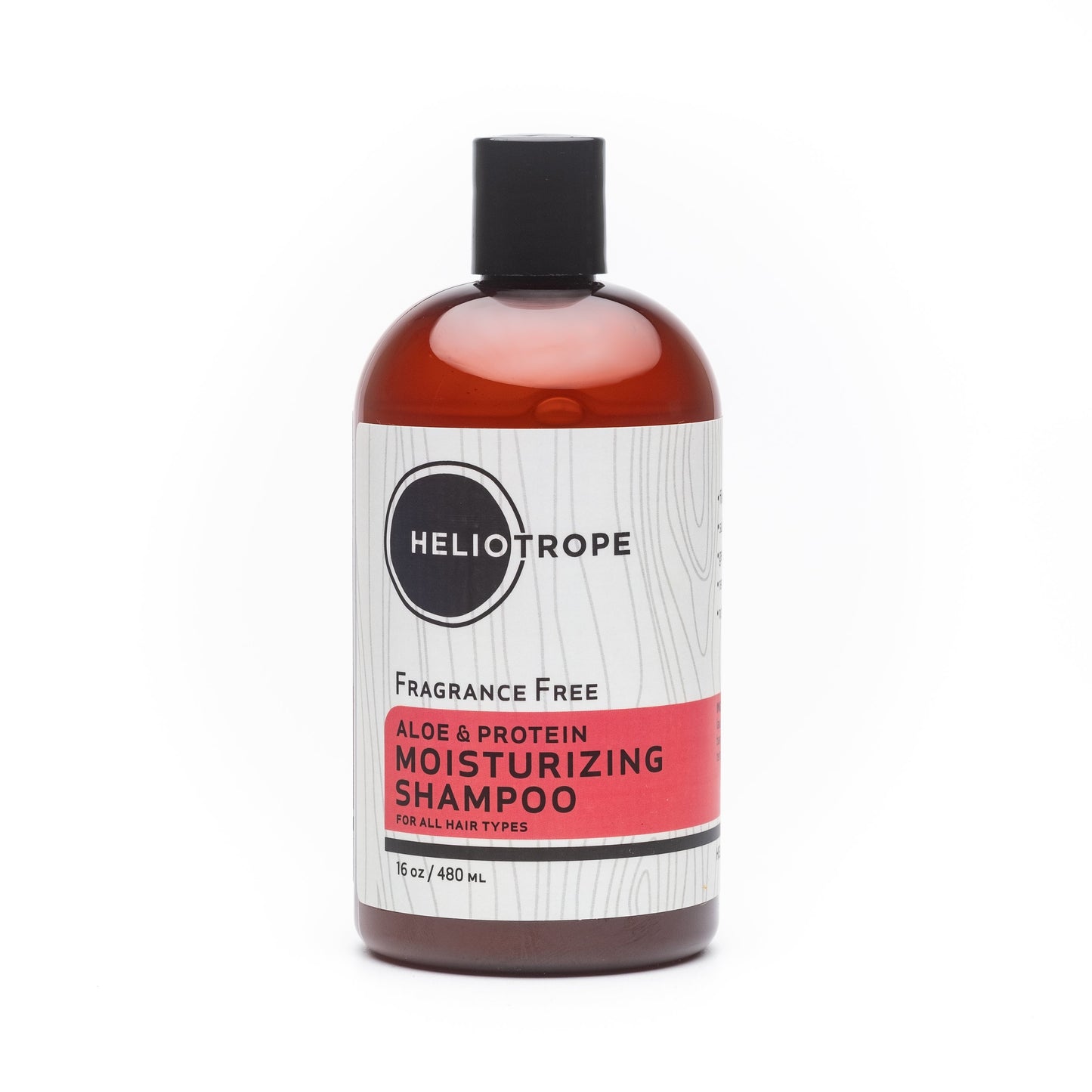 Shampoo bottle, fragrance-free; aloe & protein moisturizing; amber liquid, black cap.